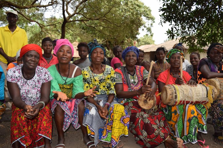 A group of women in traditional colourful dresses